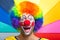 Smiling clown on a colorful background