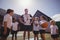 Smiling coach and schoolkids interacting with each other