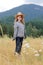 Smiling country girl standing in field