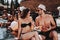 Smiling Couple with Alcoholic Drinks at Poolside