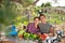 Smiling couple of amateur gardeners at table in garden