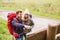 Smiling couple with backpacks hiking