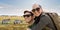 Smiling couple with backpacks traveling in africa