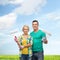 Smiling couple in gloves with paint rollers