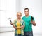 Smiling couple with hammer and drill