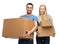 Smiling couple holding cardboard boxes