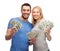 Smiling couple holding dollar cash money