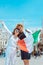 smiling couple holding italian flag venice central square san marco