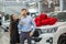 Smiling couple with new bought dealership