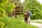 Smiling couple at signpost with backpacks hiking