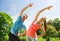 Smiling couple stretching outdoors