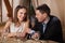 Smiling couple waiting for dinner in restaurant