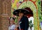 Smiling cowboy and girl on parade float