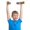 Smiling cute sport boy exercising with dumbbells isolated on white.