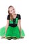 Smiling dancer girl in green tutu skirt sitting