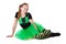 Smiling dancer in green tutu skirt sitting