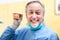 Smiling dentist holding a denture