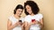 Smiling diverse girlfriends use modern smartphones texting