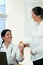 Smiling doctor giving vitamins to a pregnant woman