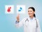 Smiling doctor or nurse pointing to pills icon