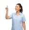 Smiling doctor or nurse pointing to something