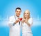 Smiling doctors cardiologists with heart