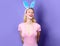 Smiling easter Girl in bunny ears. Happy Rabbit woman. Holidays, spring and party concept.