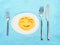 Smiling Egg. Concept of a protein diet. Boiled egg and with cutlery on the table.