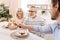 Smiling elderly couple relishing dinner with their child at home