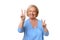 Smiling elderly woman giving a double v-sign