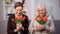 Smiling elderly women holding bouquets of tulips, happy mothers day, present
