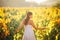 Smiling elegant woman in nature.Joy and happiness.Serene female in wine grape field in sunset.Wine growing field.Agricultural tour