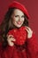 smiling elegant woman in red sweater and beret