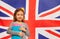 Smiling English schoolgirl with textbooks