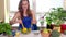 Smiling expectant mother pour salt and mix ecologic natural vegetables salad