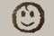 Smiling Face image made up of coffee beans.