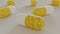 Smiling face textured medicine tablets lying on flat surface. Antidepressant medication concept.