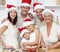 Smiling family baking Christmas cakes