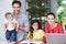 Smiling family at desk