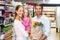 Smiling family with grocery bag at the supermarket