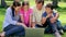 Smiling family looking at a laptop together