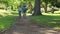 Smiling family riding bikes on a pathway