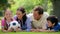 Smiling family trying to catch a soccer ball