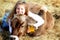 Smiling farm girl and pet calf