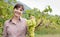 Smiling farmer holding grapes