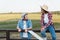 smiling farmer talking to african american