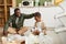 Smiling Father and Son Sorting Plastic at Home