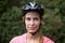 Smiling female athletic wearing bicycle helmet