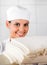 Smiling Female Baker With Bread Slices In Bakery