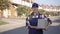Smiling female delivery courier posing on camera